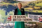 Alison Griffiths MP with a sign saying "Back British Farming"